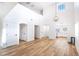 Bright and airy living room with high ceilings, hardwood floors, and an open floor plan at 1011 Pearl Marble Ave, North Las Vegas, NV 89081