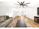 Spacious living room featuring modern décor, hardwood floors, and comfortable seating at 1011 Pearl Marble Ave, North Las Vegas, NV 89081