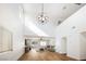 Bright living room with high ceilings, a modern chandelier, and hardwood floors at 1011 Pearl Marble Ave, North Las Vegas, NV 89081