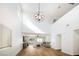 Spacious living room with hardwood floors and a modern light fixture with ample natural light at 1011 Pearl Marble Ave, North Las Vegas, NV 89081