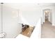 Open loft area featuring neutral carpet, and view of the bathroom and living room at 1011 Pearl Marble Ave, North Las Vegas, NV 89081