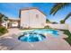 Inviting backyard pool and spa with lush landscaping, perfect for relaxing or entertaining guests at 1011 Pearl Marble Ave, North Las Vegas, NV 89081