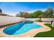 Sparkling pool and spa with plenty of patio space and green turf, ideal for outdoor enjoyment at 1011 Pearl Marble Ave, North Las Vegas, NV 89081