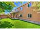 Expansive backyard boasts a well-maintained lawn, covered patio area, and ample space for recreation and relaxation at 10116 Nash Peak Ave, Las Vegas, NV 89166