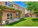 Beautiful backyard featuring a lush lawn, covered patio, and mature landscaping, perfect for outdoor entertaining at 10116 Nash Peak Ave, Las Vegas, NV 89166