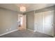 Neutral gray bedroom featuring a spacious closet and modern light fixture at 10116 Nash Peak Ave, Las Vegas, NV 89166