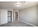Neutral bedroom featuring gray walls, plush carpeting and a closet with classic paneled doors at 10116 Nash Peak Ave, Las Vegas, NV 89166