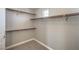 Walk-in closet featuring carpeted flooring, built-in shelving and racks providing optimal storage solutions at 10116 Nash Peak Ave, Las Vegas, NV 89166