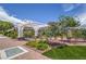 Relaxing community park featuring a white pergola, park bench, and flowers at 10116 Nash Peak Ave, Las Vegas, NV 89166