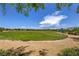 Large, grassy field with walking paths and trees offers recreational opportunities at 10116 Nash Peak Ave, Las Vegas, NV 89166