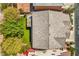 Aerial shot of roof, backyard with grass and patio area, and lush, mature trees at 10116 Nash Peak Ave, Las Vegas, NV 89166