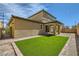 Fully fenced backyard featuring pavers, gravel, and artificial grass at 10271 Bark Pine Ct, Las Vegas, NV 89166