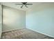 Neutral bedroom with carpet flooring, ceiling fan, and natural light at 10271 Bark Pine Ct, Las Vegas, NV 89166