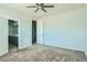 Bedroom featuring carpeting and doors to bathroom at 10271 Bark Pine Ct, Las Vegas, NV 89166