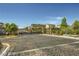 Gated community entrance with decorative ironwork and manicured landscaping at 10271 Bark Pine Ct, Las Vegas, NV 89166
