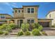 Charming two-story home with a two car garage and well-manicured front yard at 10271 Bark Pine Ct, Las Vegas, NV 89166