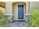 Stylish front entrance with stone accents and a modern door at 10271 Bark Pine Ct, Las Vegas, NV 89166