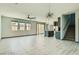 Open concept living space with lots of natural light and tile floors at 10271 Bark Pine Ct, Las Vegas, NV 89166