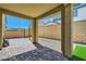 Covered patio with brick flooring and open view to backyard at 10271 Bark Pine Ct, Las Vegas, NV 89166