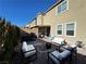 Inviting backyard featuring a patio, lounge seating, and manicured landscaping at 10383 Andele Ave, Las Vegas, NV 89166