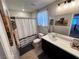 Neutral bathroom with a shower-tub combination, single vanity, and tile floor at 10383 Andele Ave, Las Vegas, NV 89166