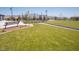 A lush green park space is accented with walking paths, benches, and landscaping at 10383 Andele Ave, Las Vegas, NV 89166