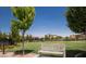 Beautiful landscaped park featuring a decorative bench with lush green grass and trees at 10383 Andele Ave, Las Vegas, NV 89166