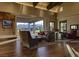 Spacious lounge with hardwood floors, comfortable seating, and large windows showcasing the community at 10383 Andele Ave, Las Vegas, NV 89166