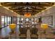 Inviting lounge area with ample seating, stylish decor, and exposed beam ceiling at 10383 Andele Ave, Las Vegas, NV 89166
