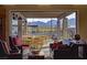 Comfortable lounge area with mountain views through an open-air patio, furnished with couches and chairs at 10383 Andele Ave, Las Vegas, NV 89166
