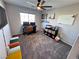 Functional home office with a desk, shelving, and plenty of natural light at 10383 Andele Ave, Las Vegas, NV 89166