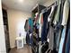 Walk-in closet with dark shelving and rod for organization at 10383 Andele Ave, Las Vegas, NV 89166