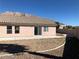 View of the home's backyard with desert landscaping, a concrete patio, and mountain views at 1083 Sterling Peak St, Las Vegas, NV 89110