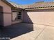Home's concrete patio extends from the rear, desert landscaping surrounds at 1083 Sterling Peak St, Las Vegas, NV 89110