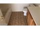 Bathroom featuring a toilet, tub, and vanity with tile floor at 1083 Sterling Peak St, Las Vegas, NV 89110