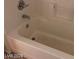 Close up of a clean bathtub with shower head at 1083 Sterling Peak St, Las Vegas, NV 89110