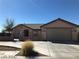 Charming single-story home with a well-maintained front yard and a two-car garage at 1083 Sterling Peak St, Las Vegas, NV 89110