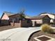 A charming single-story home featuring a well-maintained yard, complemented by a spacious driveway at 1083 Sterling Peak St, Las Vegas, NV 89110