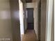 Hallway with tile flooring, bedroom access, and neutral walls at 1083 Sterling Peak St, Las Vegas, NV 89110