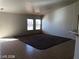 Spacious living room with neutral paint, tile flooring, and a cozy rug at 1083 Sterling Peak St, Las Vegas, NV 89110