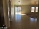 Bright living room featuring tiled floors and sliding glass doors to the backyard at 1083 Sterling Peak St, Las Vegas, NV 89110