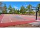 Community basketball court surrounded by mature trees and manicured landscaping at 11 Morninglow Pass, Henderson, NV 89052
