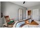 Bedroom featuring neutral colors, ceiling fan, and rocking chair at 11 Morninglow Pass, Henderson, NV 89052