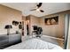 Bedroom featuring neutral colors, ceiling fan, and gaming station at 11 Morninglow Pass, Henderson, NV 89052