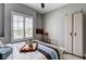 Bedroom featuring neutral colors, ceiling fan, and shutters at 11 Morninglow Pass, Henderson, NV 89052
