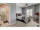 Bedroom featuring neutral colors, ceiling fan, and connected bathroom at 11 Morninglow Pass, Henderson, NV 89052