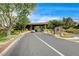 Attractive community entrance with stone signage and well-maintained landscaping at 11 Morninglow Pass, Henderson, NV 89052