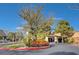 Community entrance featuring vibrant landscaping and a covered entrance, offering a welcoming first impression to the neighborhood at 11 Morninglow Pass, Henderson, NV 89052