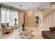 Bright foyer features light wood floors, staircase and front door at 11 Morninglow Pass, Henderson, NV 89052