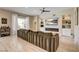 Spacious living room featuring a large sectional sofa and built-in shelves at 11 Morninglow Pass, Henderson, NV 89052